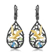 Cercei din Argint Reins, cu pietre semi-pretioase Swiss Blue Topaz si Peridot - Bird perched, vedere pe fundal alb, 03R01-0002